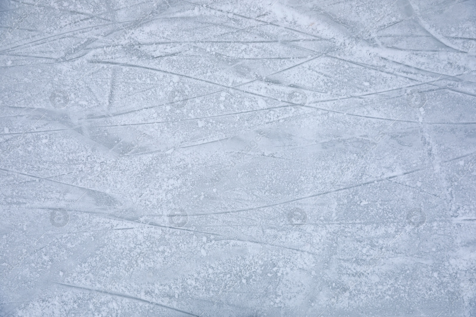 Photo of Traces left by figure skate blades on ice. Winter outdoors activities