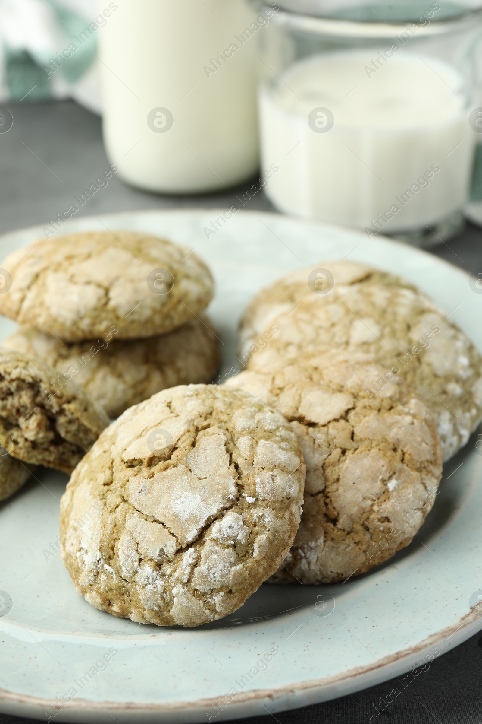 Photo of Plate with tasty matcha cookies on table, closeup