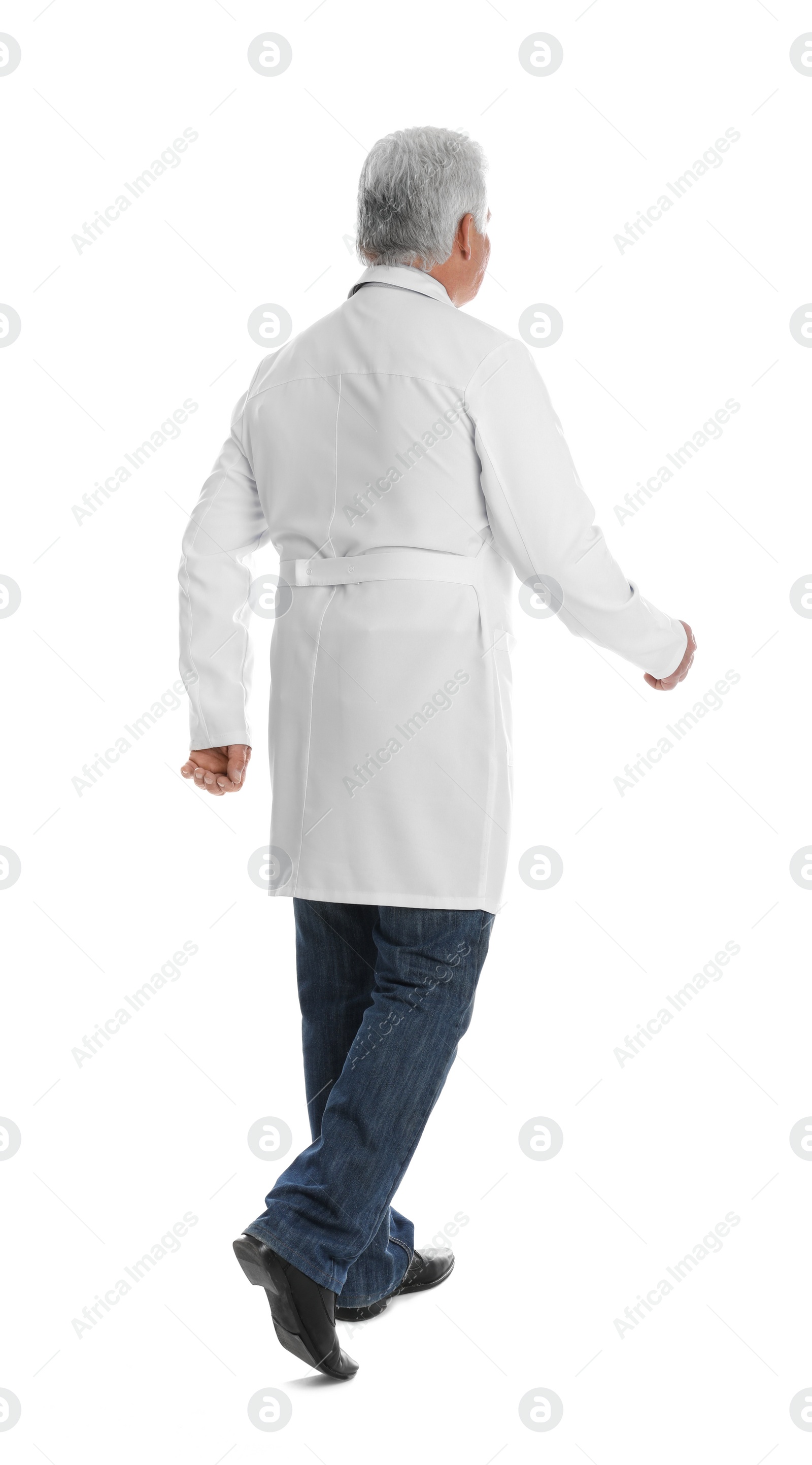 Photo of Senior doctor walking on white background, back view