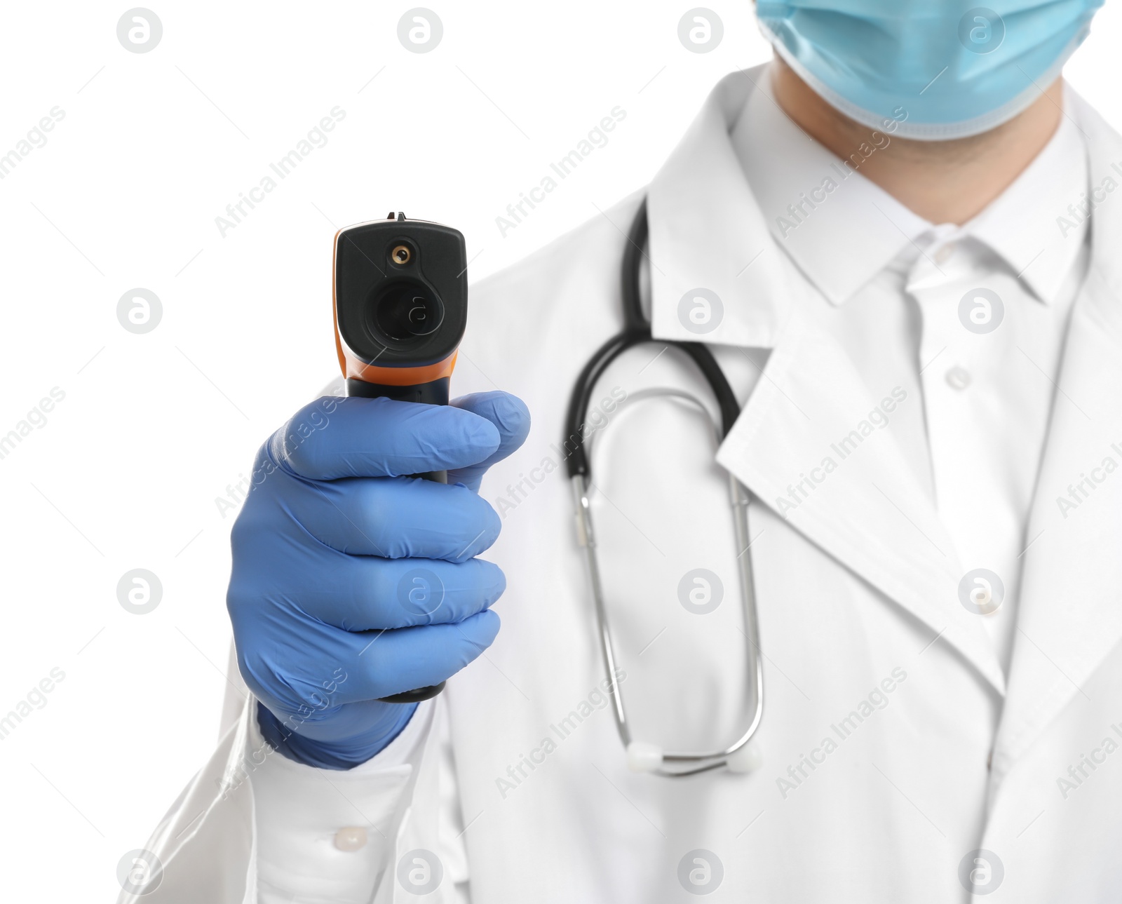 Photo of Doctor in latex gloves holding non contact infrared thermometer on white background, closeup. Measuring temperature