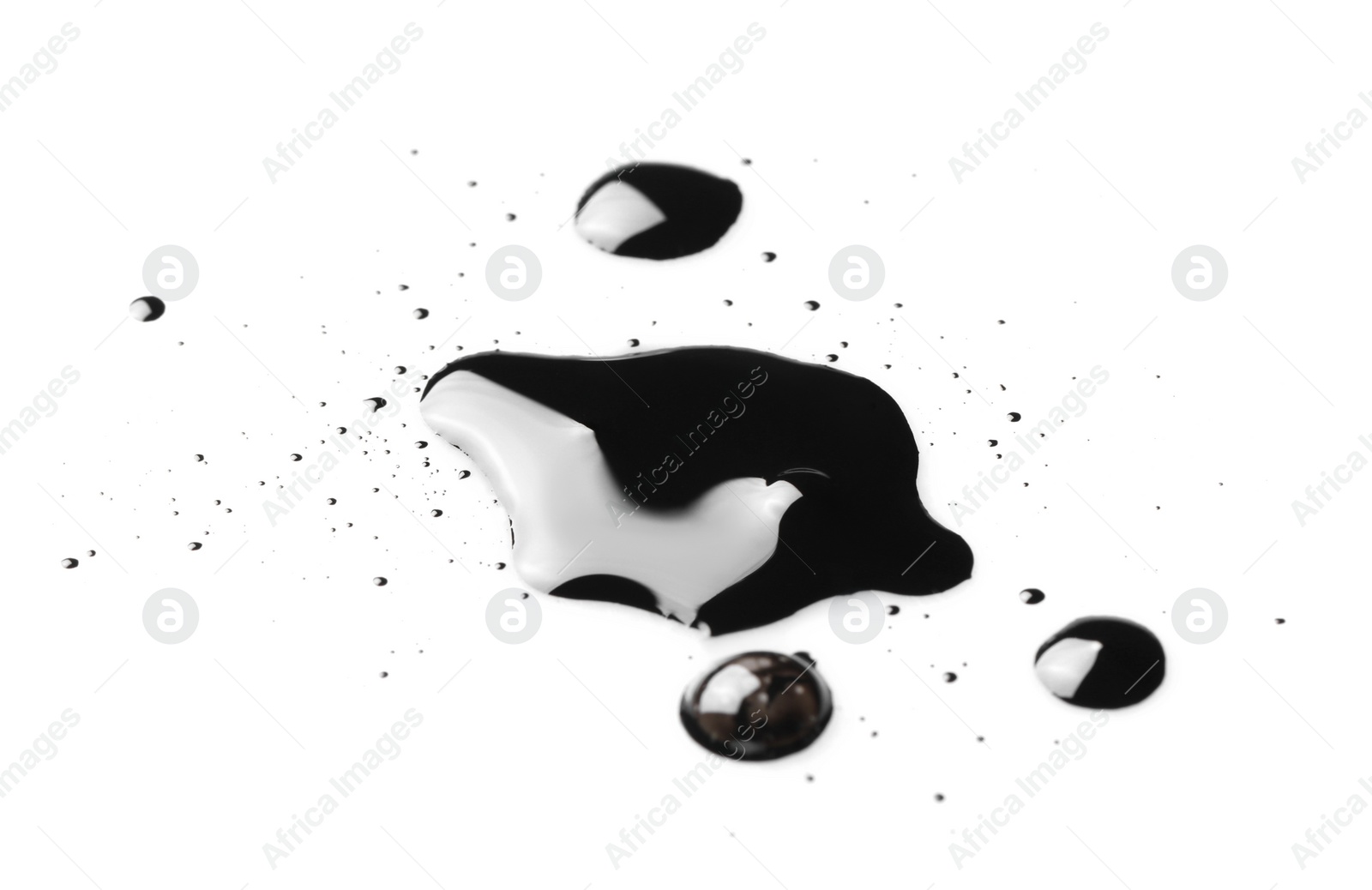 Photo of Blobs of black oil isolated on white