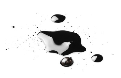 Photo of Blobs of black oil isolated on white