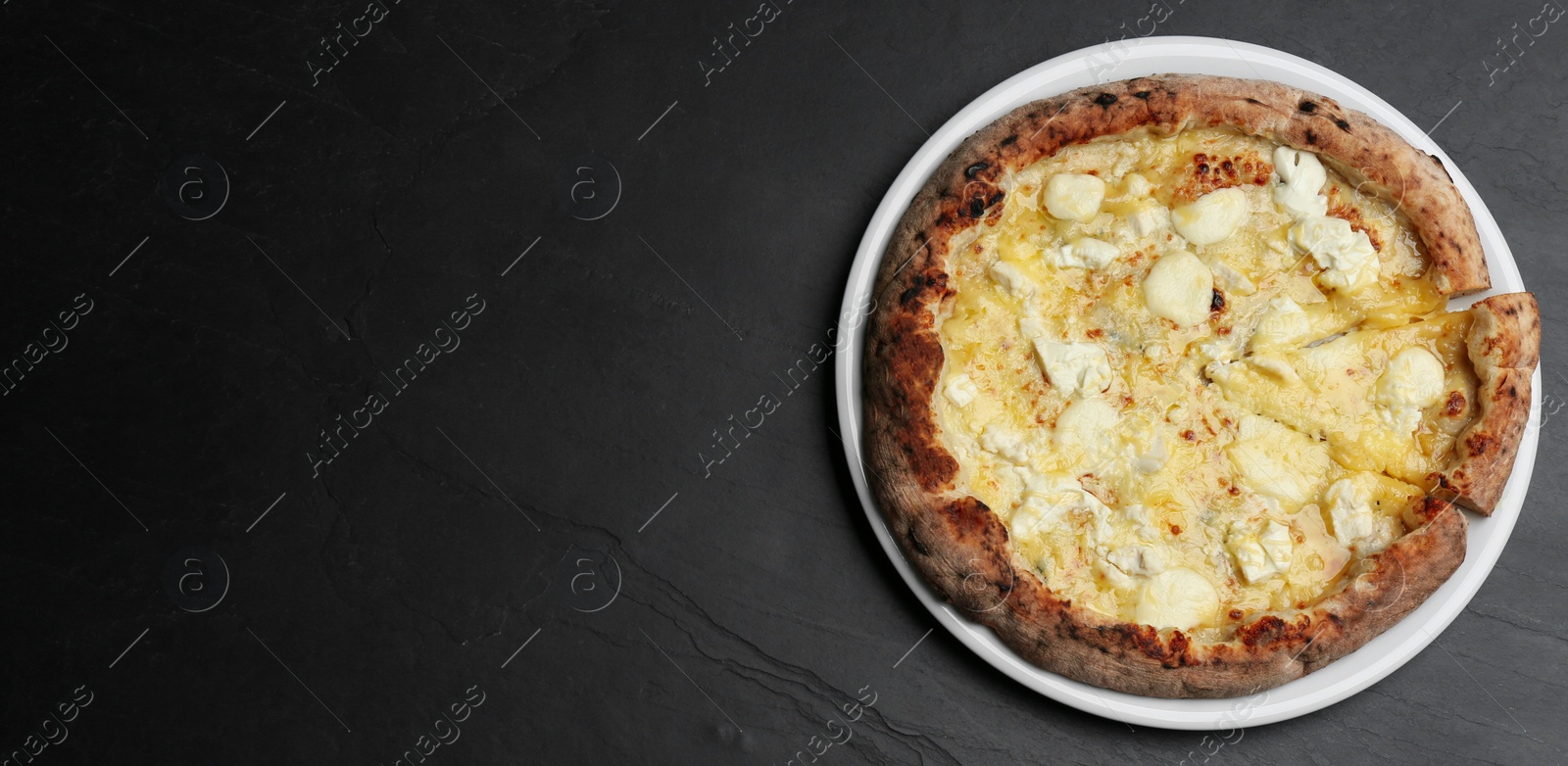 Photo of Tasty cheese pizza on black table, top view. Space for text