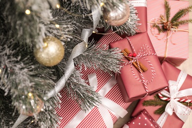 Many different gifts under Christmas tree, above view