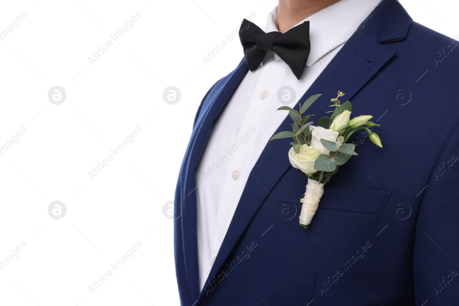 Photo of Groom with boutonniere on white background, closeup. Wedding accessory