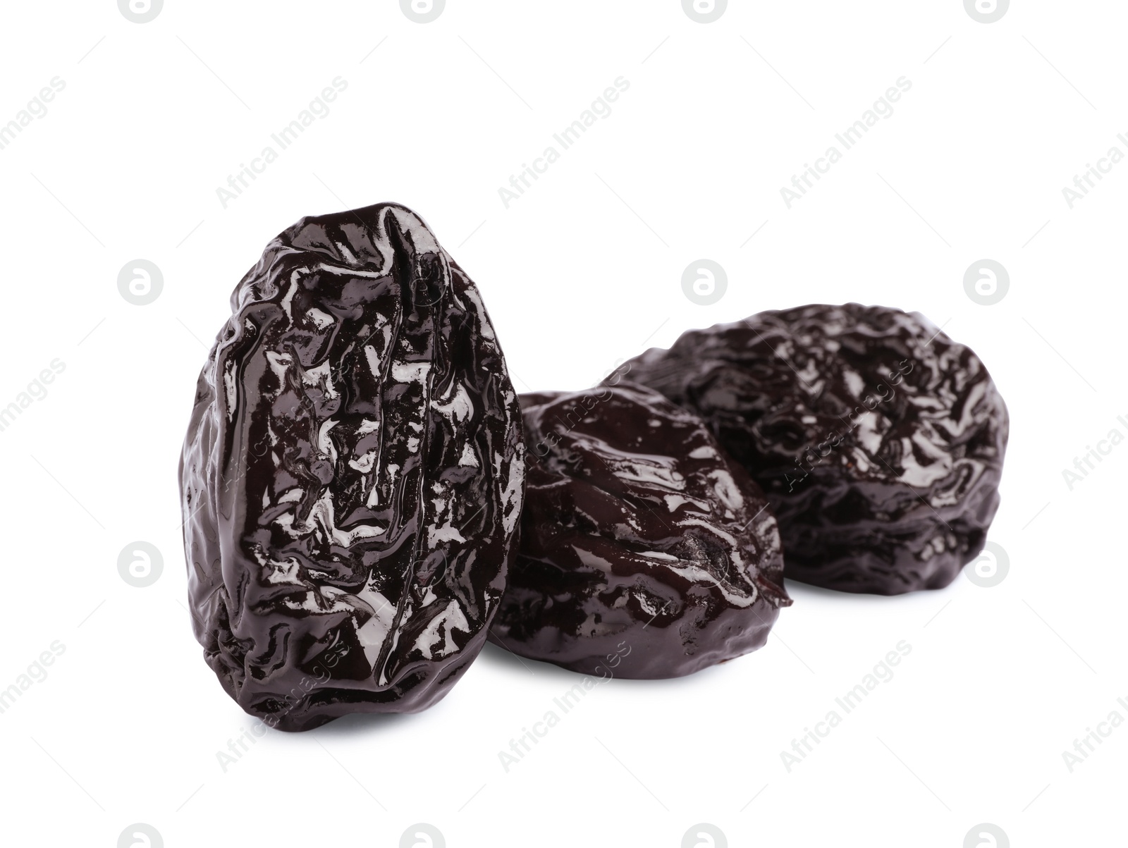 Photo of Sweet dried prunes on white background. Healthy snack