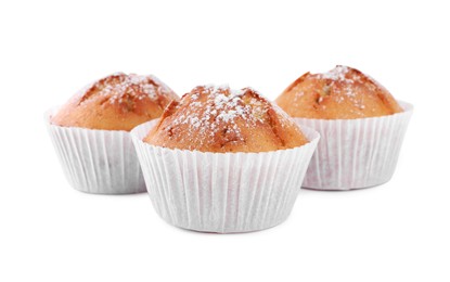 Tasty muffins powdered with sugar on white background