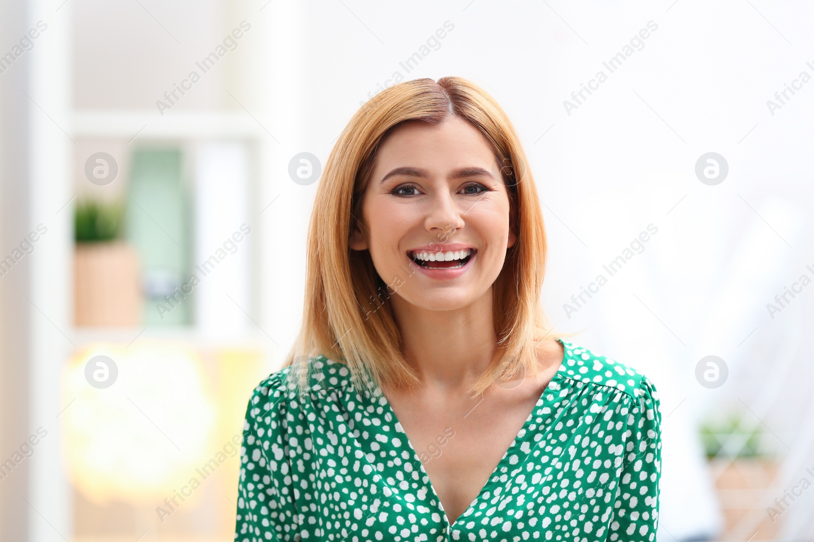 Photo of Beautiful woman using video chat for conversation indoors