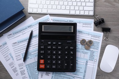Tax accounting. Flat lay composition with calculator and documents on wooden table