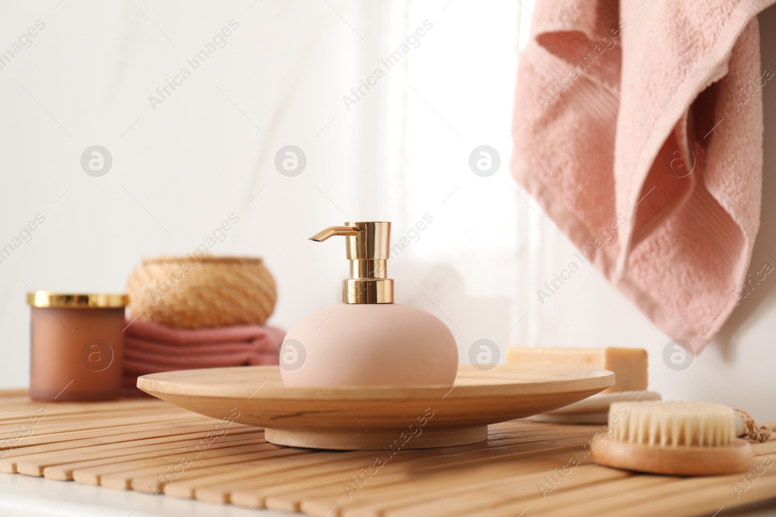 Photo of Different toiletries on wooden countertop in bathroom