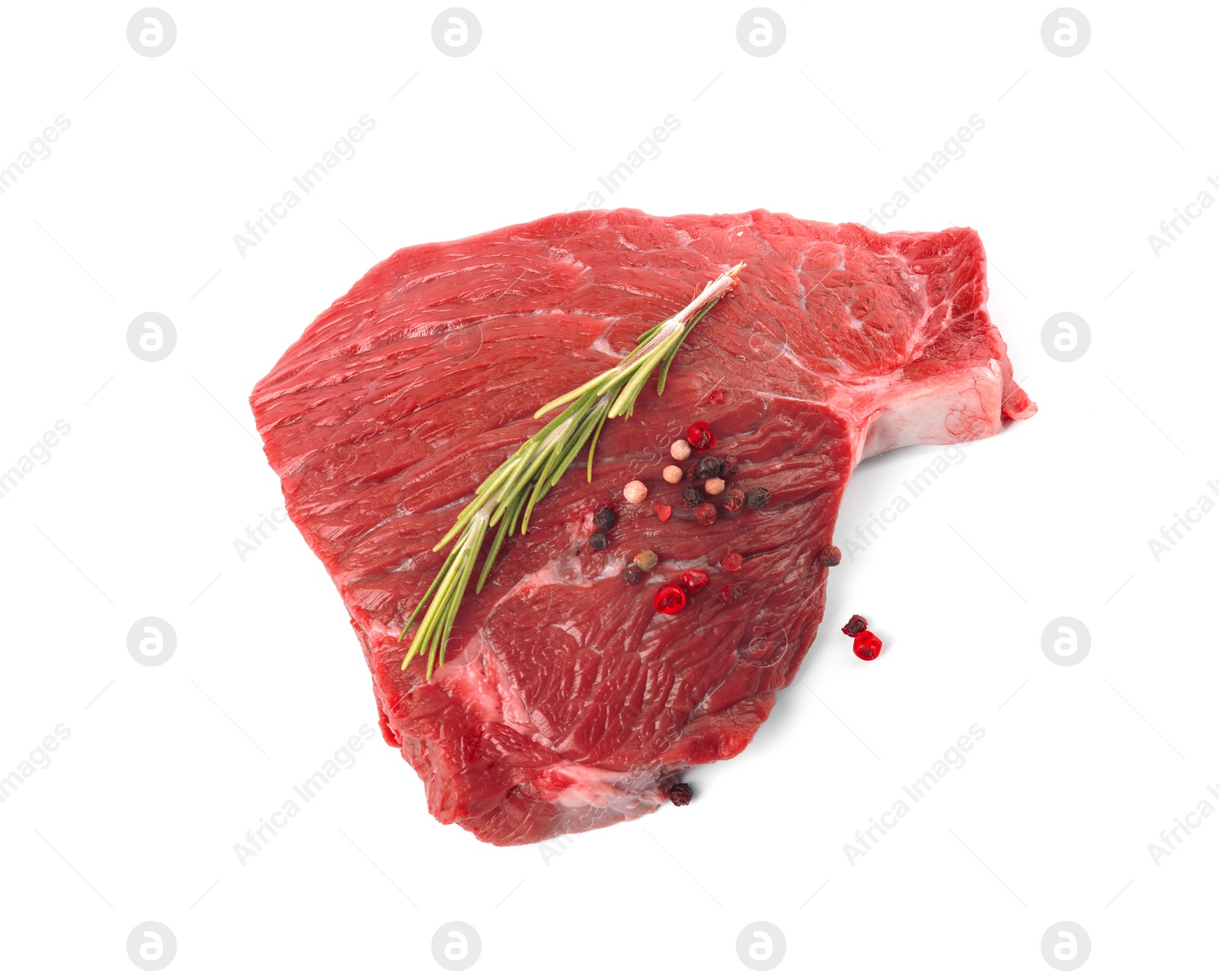 Photo of Fresh raw beef cut with rosemary and peppers mix isolated on white, above view