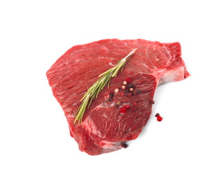 Photo of Fresh raw beef cut with rosemary and peppers mix isolated on white, above view