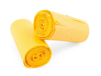 Photo of Two rolls of yellow garbage bags isolated on white