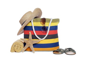 Photo of Stylish bag, starfish and other beach accessories isolated on white