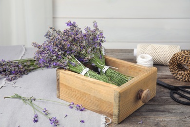 Photo of Composition with blooming lavender flowers on table