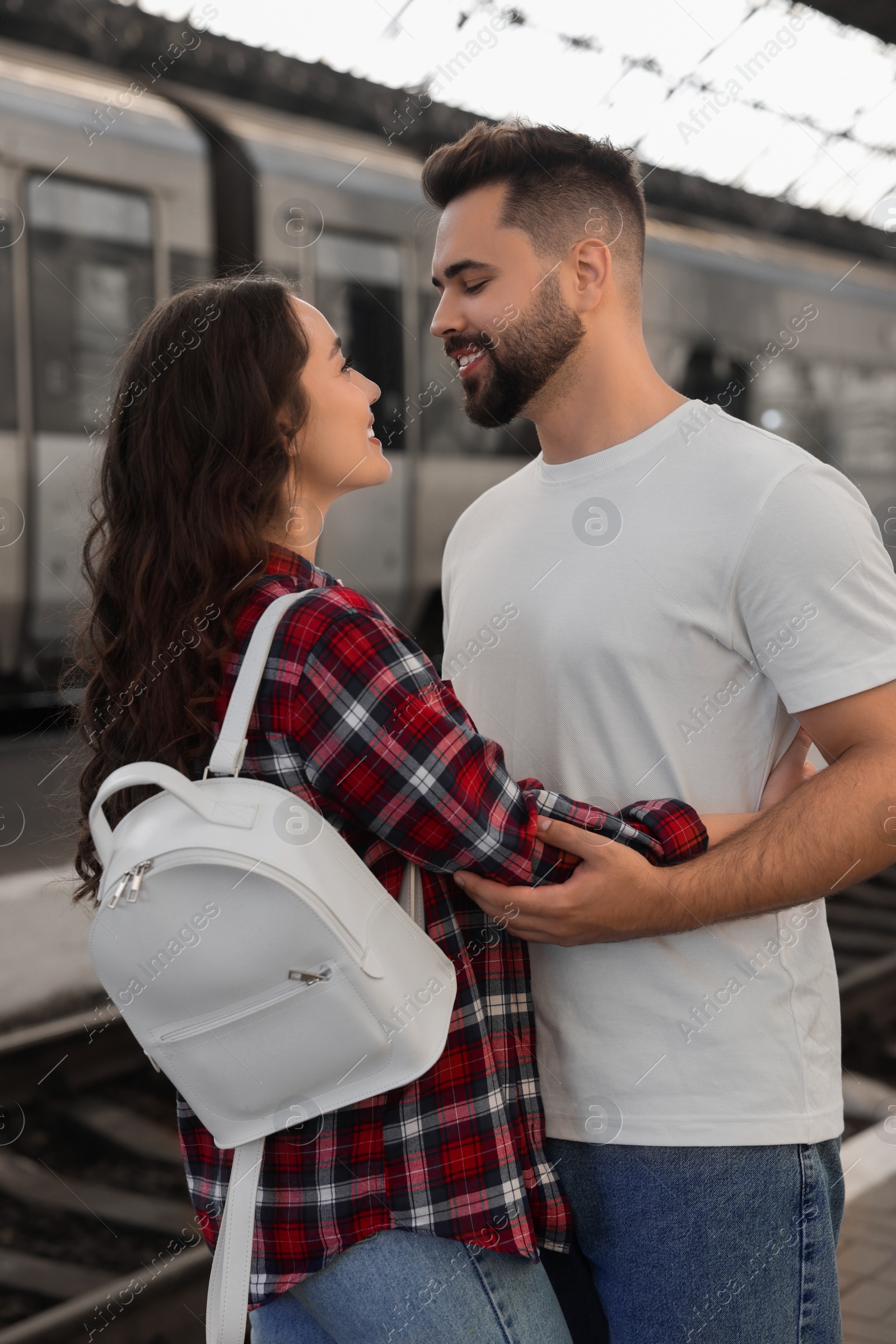 Photo of Long-distance relationship. Beautiful couple on platform of railway station