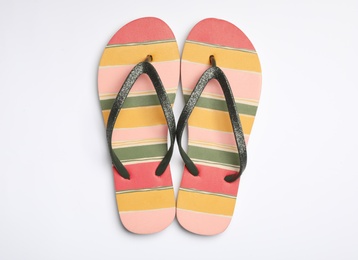 Pair of flip flops on white background, top view. Beach accessories