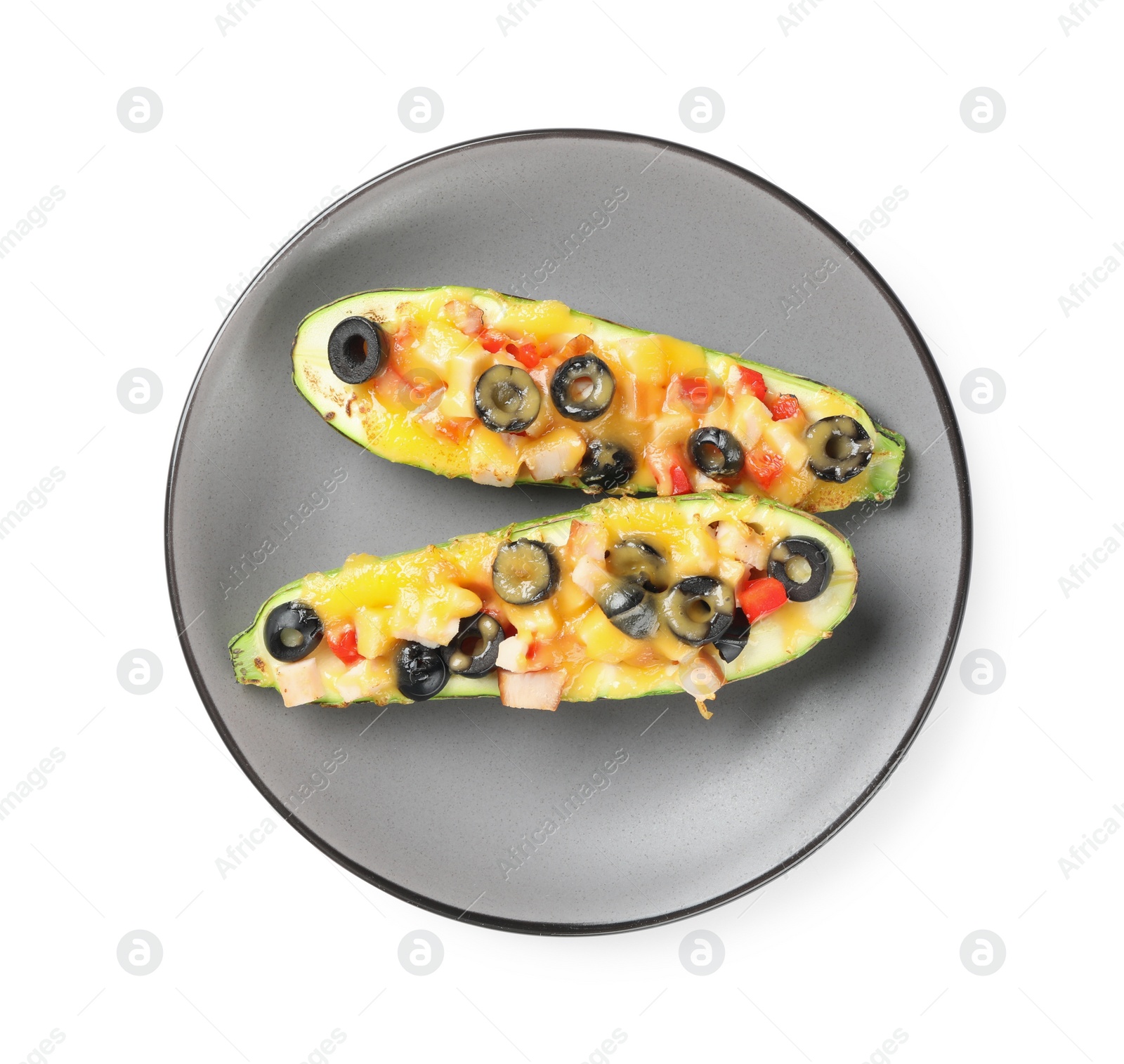 Photo of Plate of baked stuffed zucchinis on white background, top view