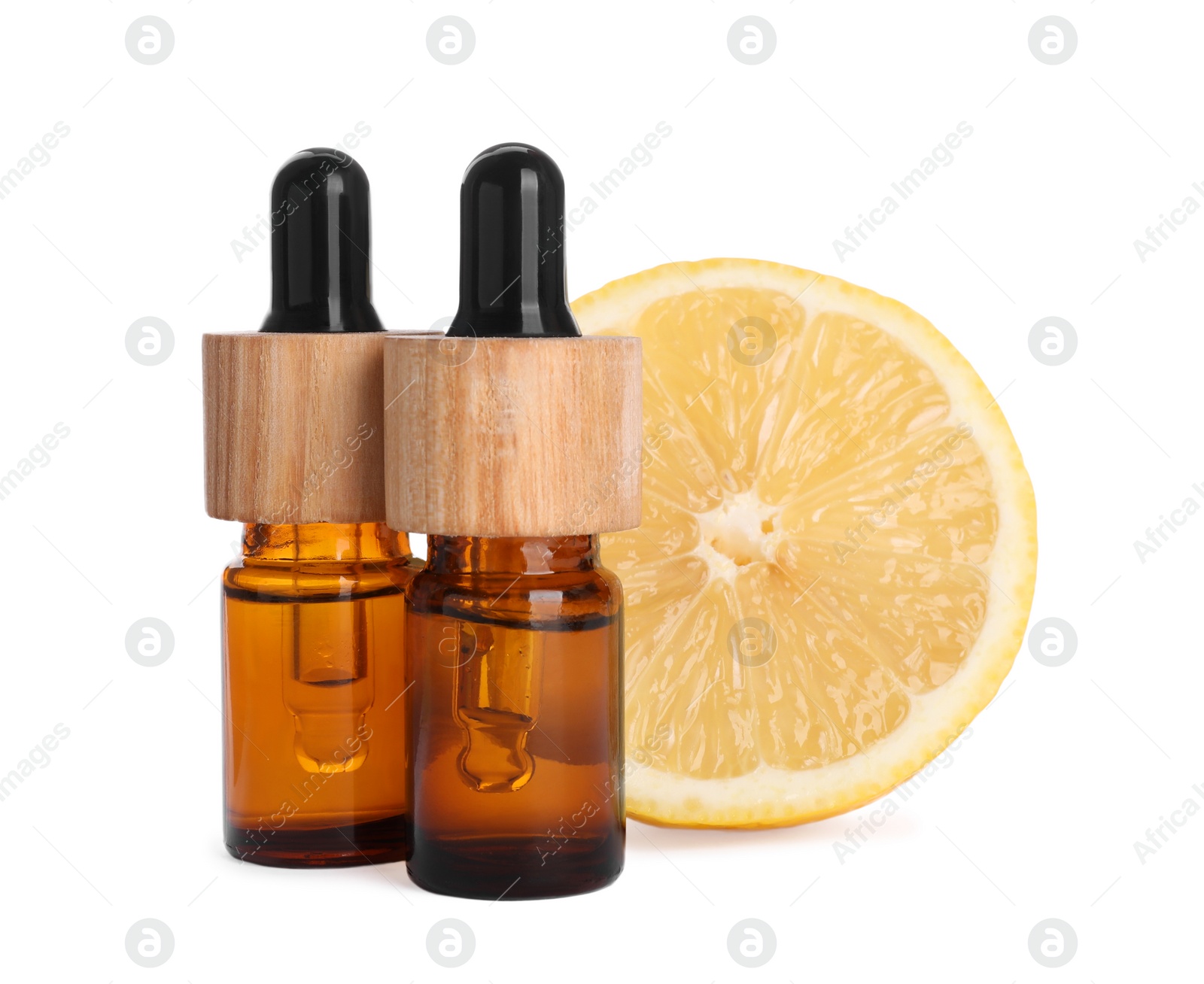 Photo of Bottles of citrus essential oil and fresh lemon isolated on white