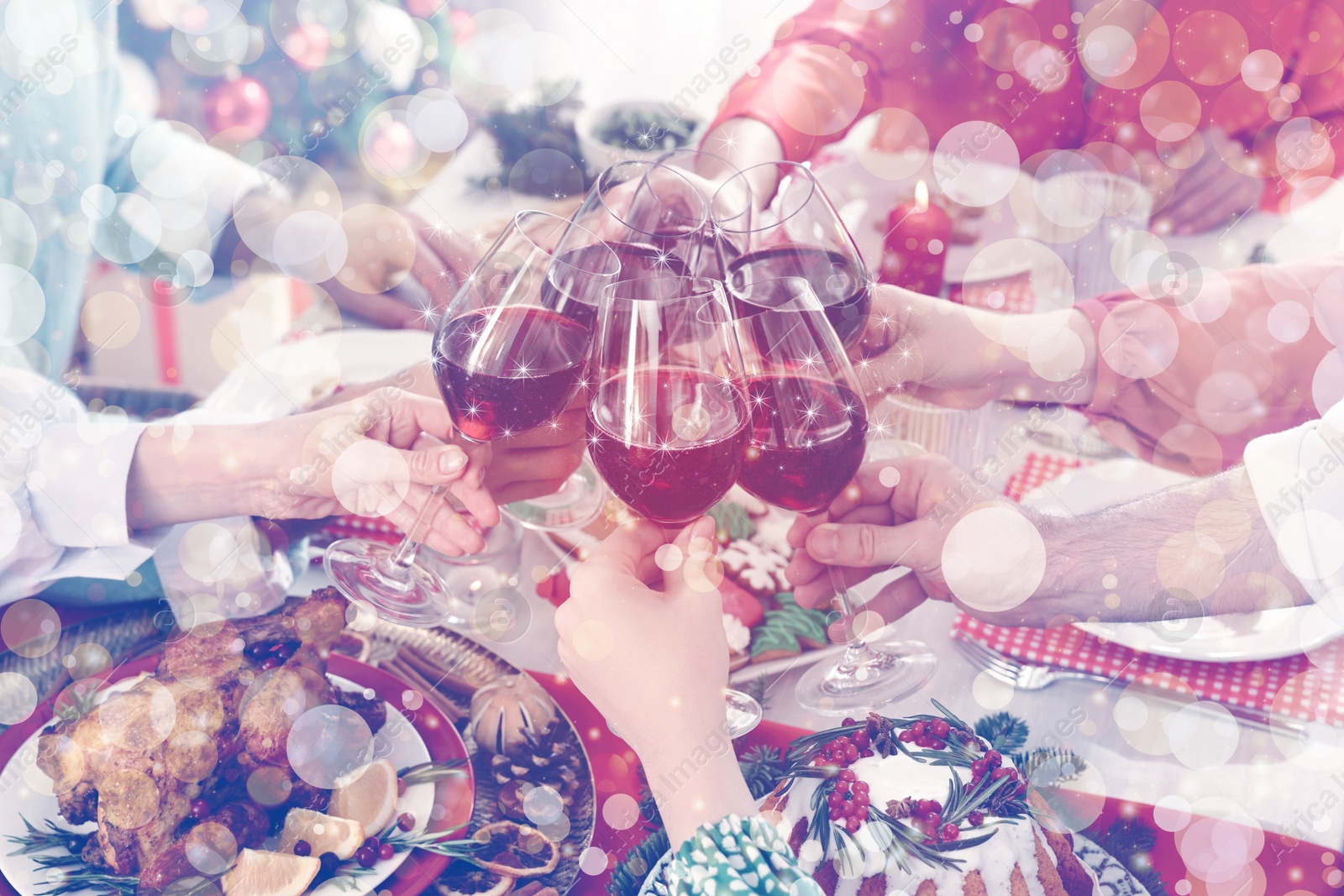 Image of Family with their friends clinking glasses at festive dinner indoors, closeup. Christmas Eve celebration