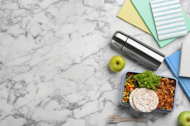 Photo of Flat lay composition with thermos and food on white marble table. Space for text