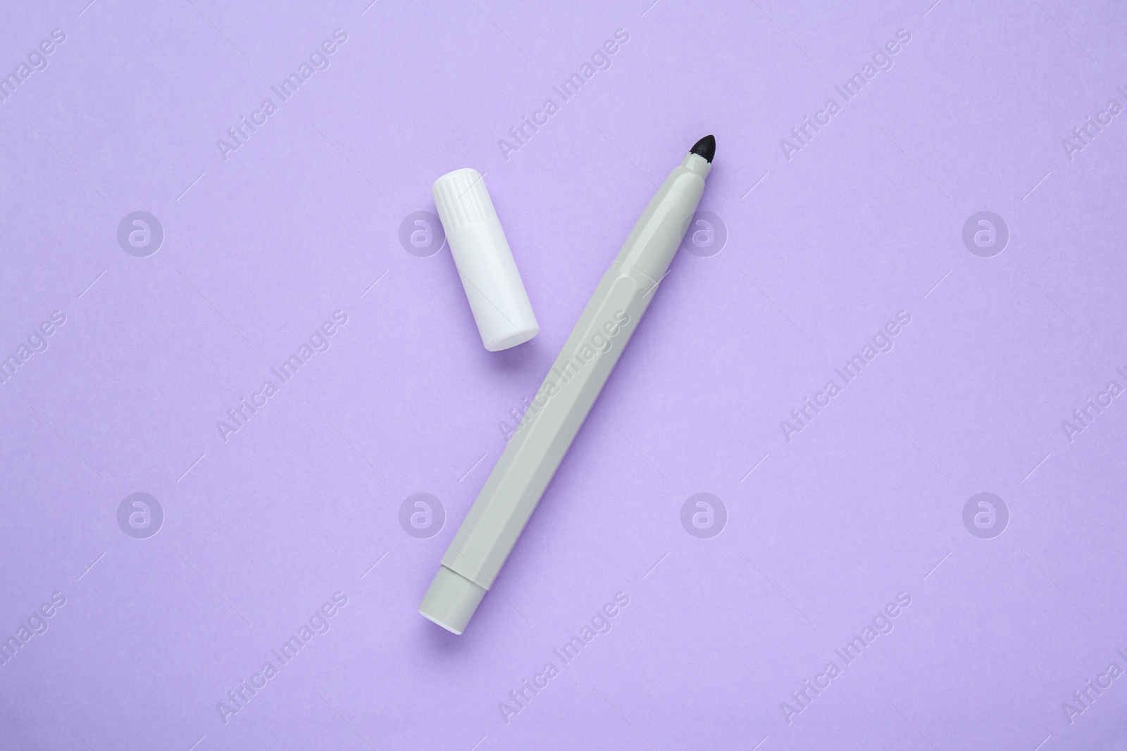 Photo of Grey marker on light background, flat lay