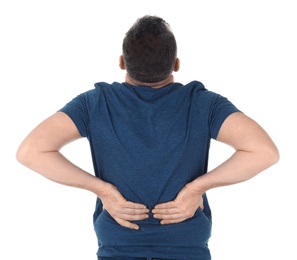 Man suffering from back pain on white background