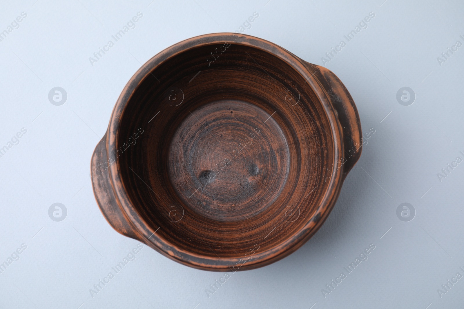 Photo of Ceramic bowl on white background, top view
