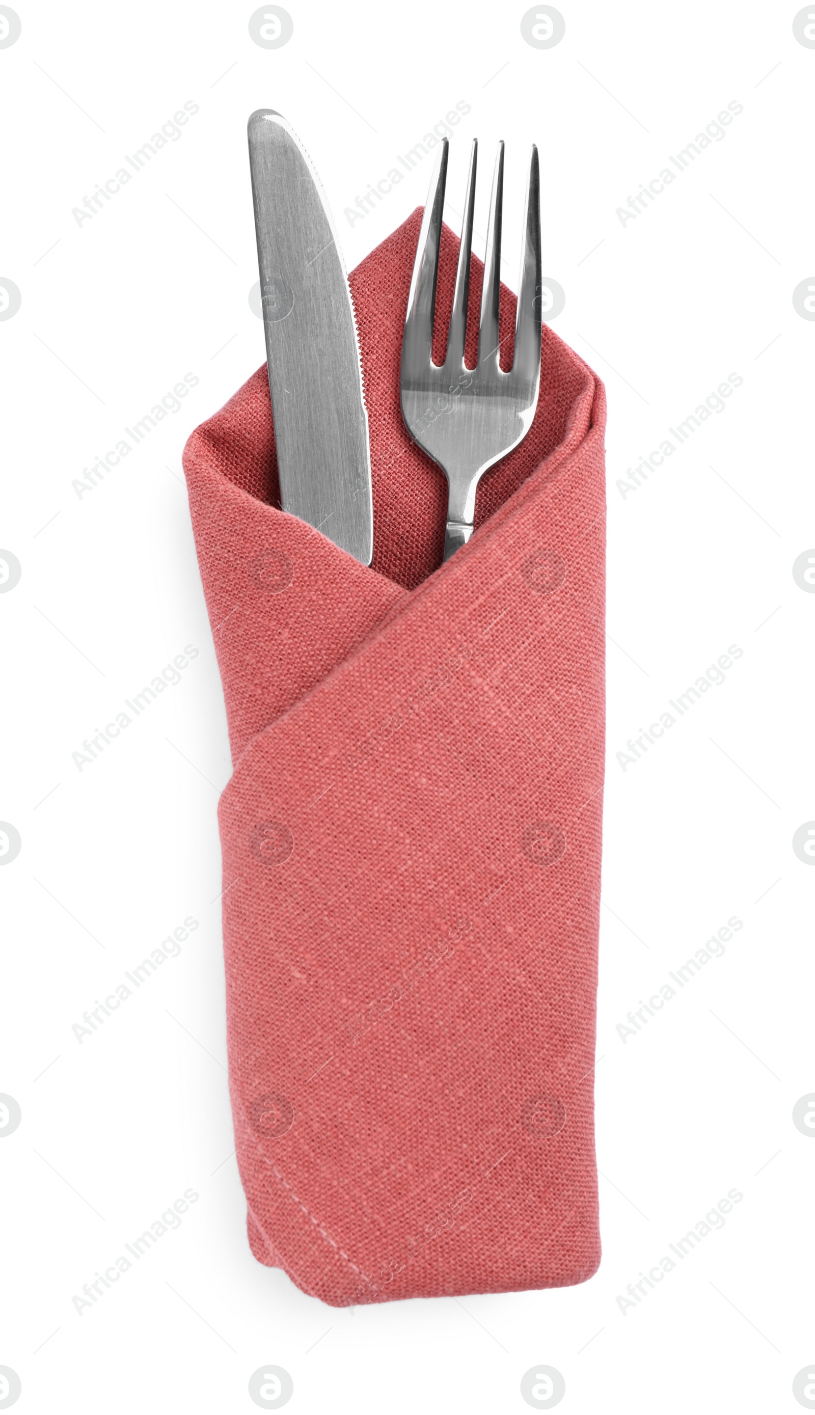 Photo of Fork and knife wrapped in coral napkin on white background, top view