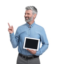 Mature businessman in stylish clothes with tablet on white background