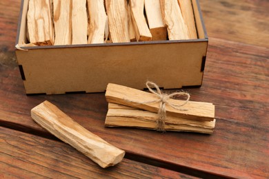 Photo of Palo Santo (holy wood) sticks on wooden table