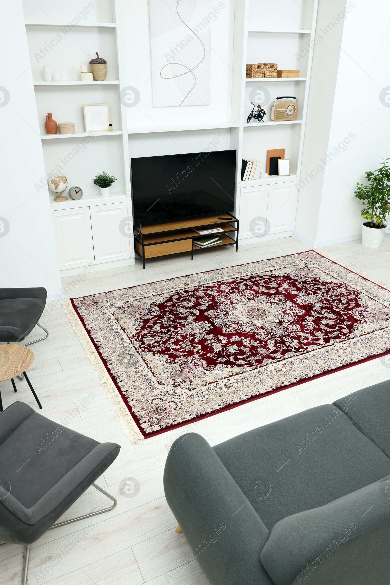 Photo of Stylish room with beautiful rug and furniture, above view. Interior design
