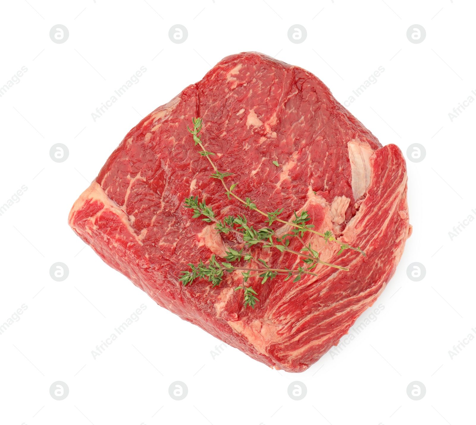 Photo of Fresh raw beef cut with thyme isolated on white