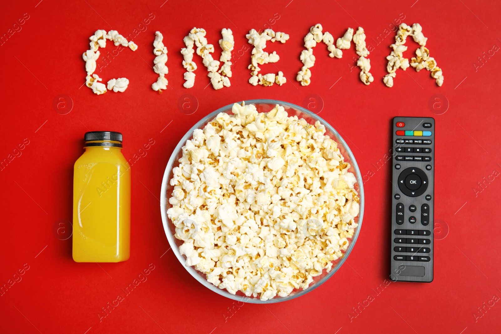 Photo of Flat lay composition with popcorn, TV remote and word CINEMA on color background