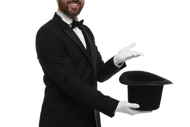 Photo of Magician holding top hat on white background, closeup