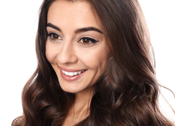 Beautiful woman with shiny wavy hair on white background