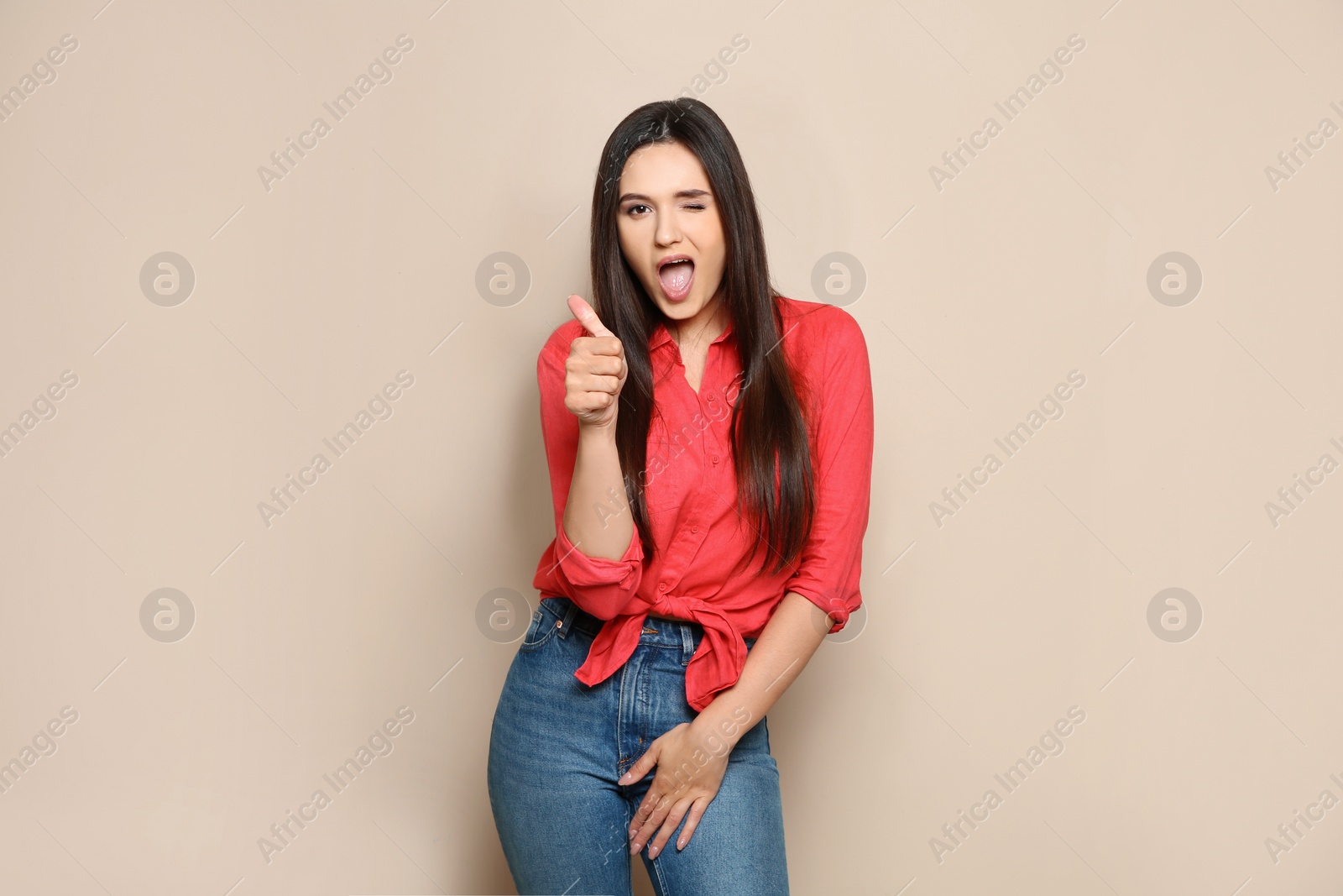 Photo of Portrait of beautiful young woman in stylish clothes on color background