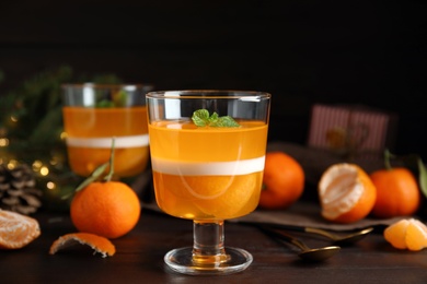 Delicious tangerine jelly on brown wooden table