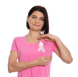 Woman with silk ribbon on white background. Breast cancer awareness concept