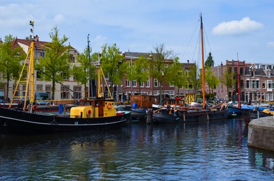 Photo of Beautiful view of city canal with moored boats