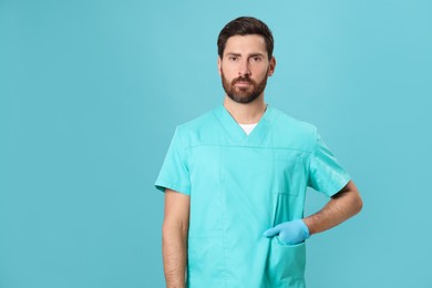 Photo of Nurse in medical uniform on light blue background