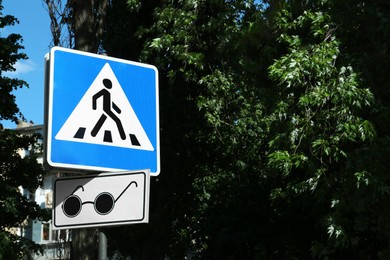 Photo of Different traffic signs near trees outdoors, space for text