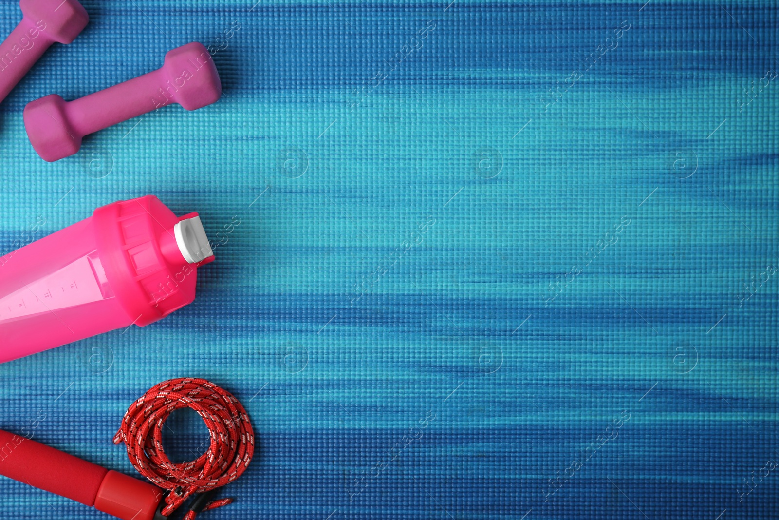 Photo of Flat lay composition of sport equipment on color background. Space for text