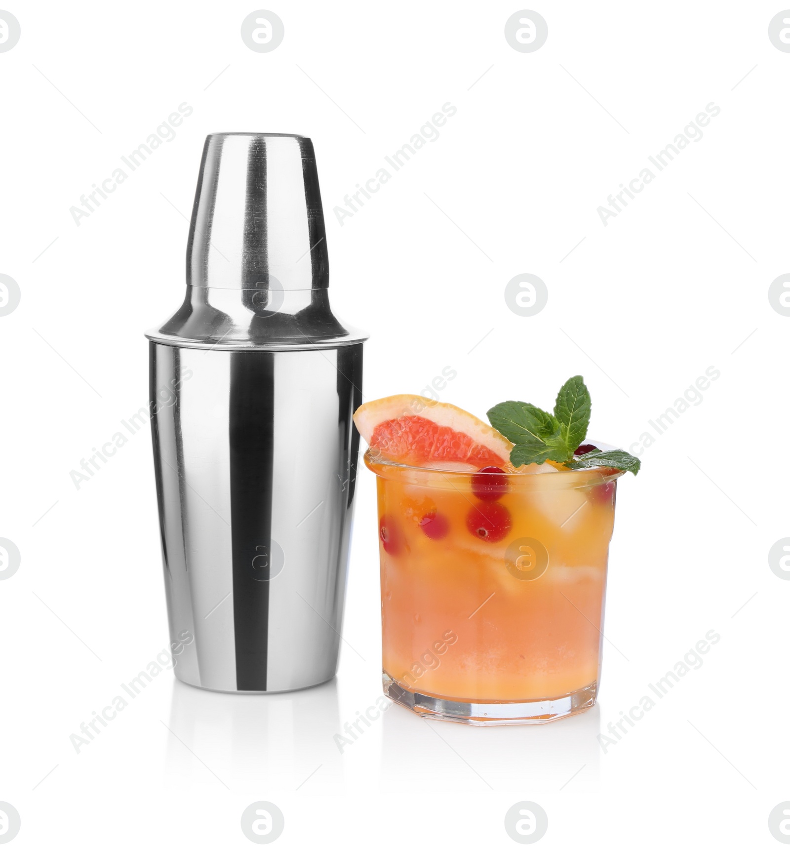 Photo of Metal shaker and delicious cocktail isolated on white