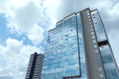 Photo of Low angle view of modern city buildings against sky