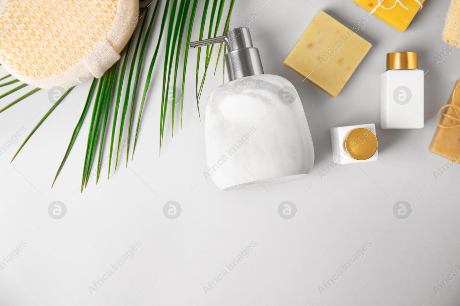 Photo of Flat lay composition with marble soap dispenser on white background. Space for text