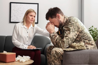 Psychologist working with military officer in office