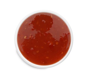 Photo of Tasty chili sauce in bowl isolated on white, top view