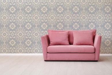 Image of Modern sofa near patterned wallpapers. Interior design 