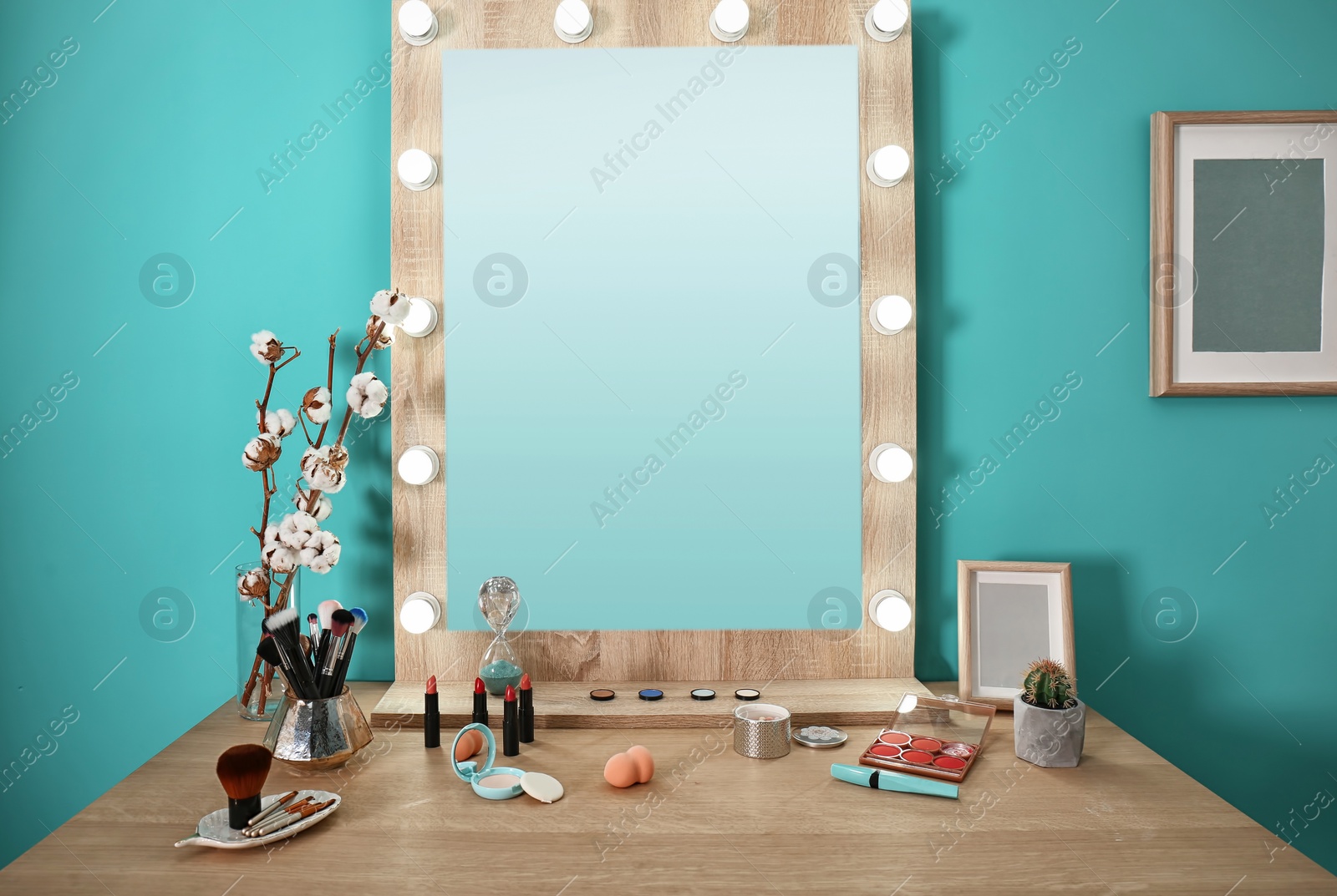 Photo of Decorative cosmetics and tools on dressing table near mirror in makeup room